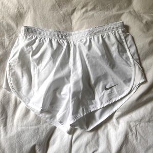 White Nike running shorts